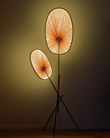 Modern floor lamp with unique design against a dark background